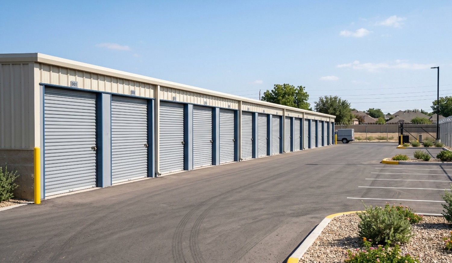 Drive-up self storage units with roll-up doors at a clean, well-secured facility